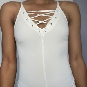 Crossed body suit